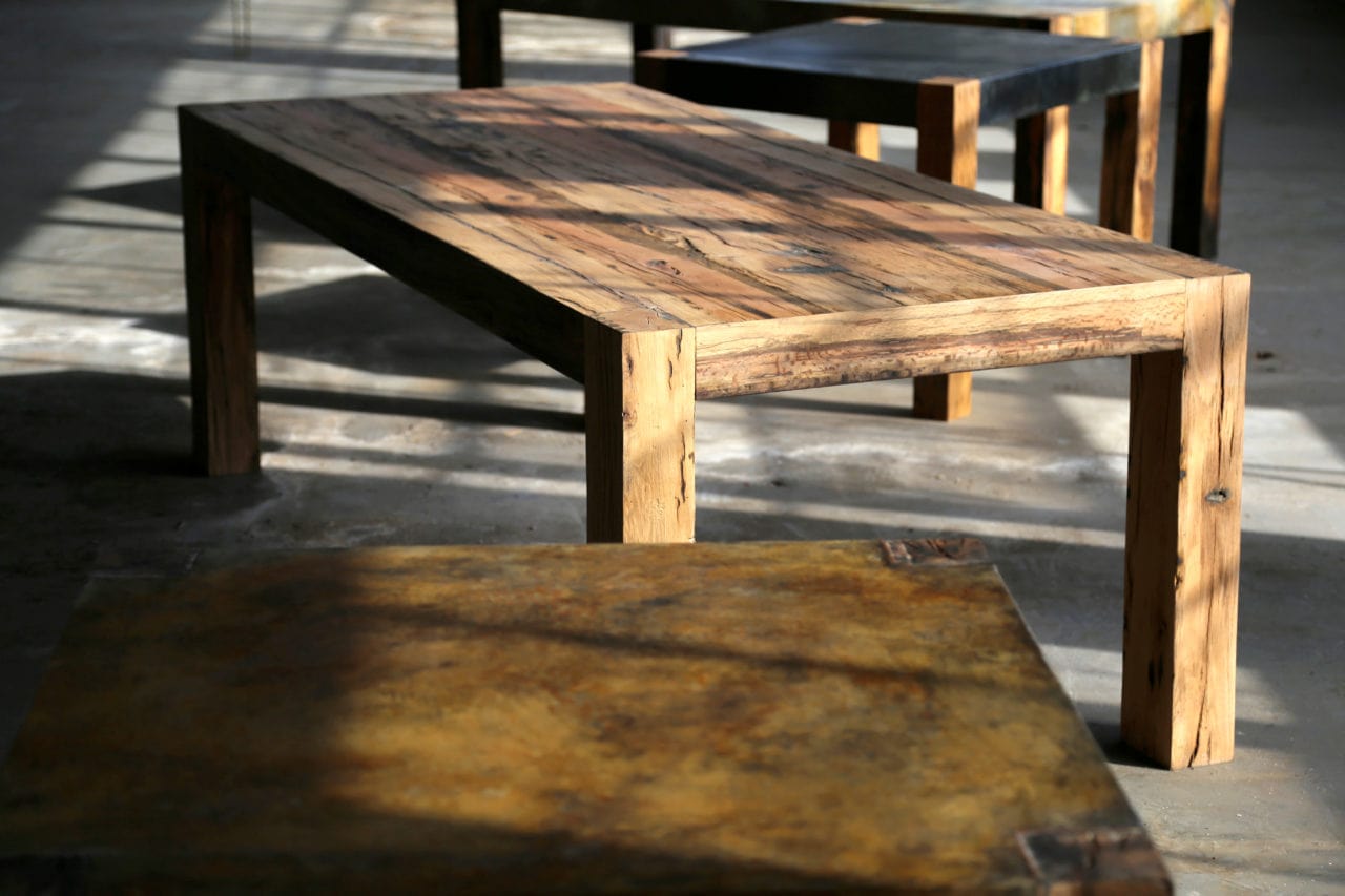 custom furniture New York models - several custom reclaimed wood SENTIENT contemporary designed communal tables with shadows