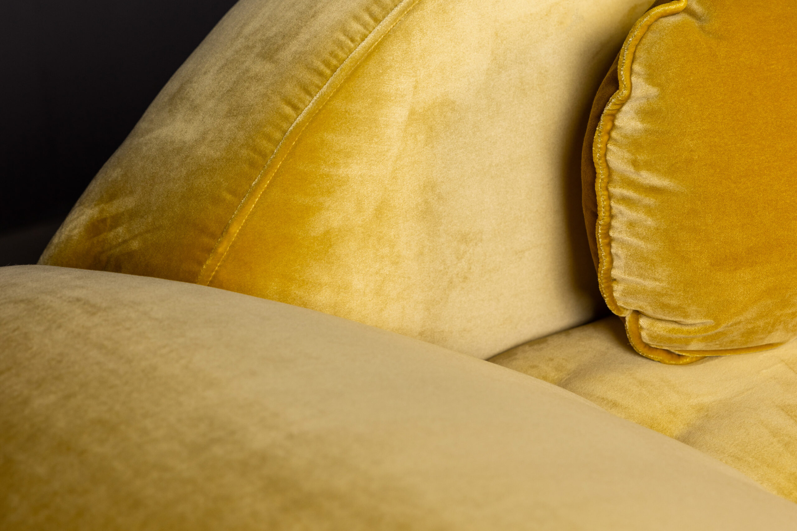 Sentient Aeon Sofa in Yellow Velvet Upholstery (Close-Up) A detailed close-up of the Sentient Aeon Sofa's soft yellow velvet upholstery, highlighting its fine texture and high-quality craftsmanship.