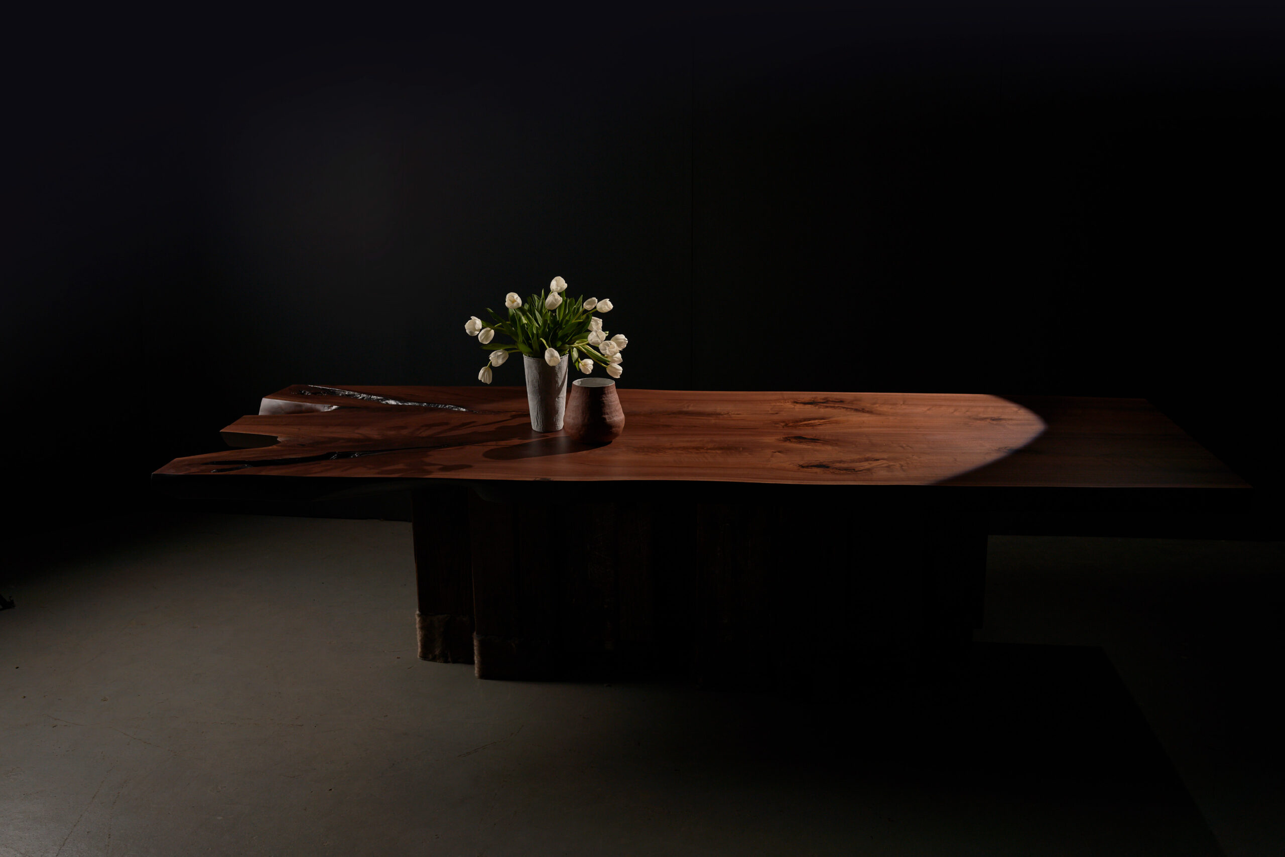 SENTIENT Evolution Artistic Live Edge Table in Black Walnu The SENTIENT Evolution table crafted in black walnut wood, highlighting the intricate details and bold natural curves of its live edge.