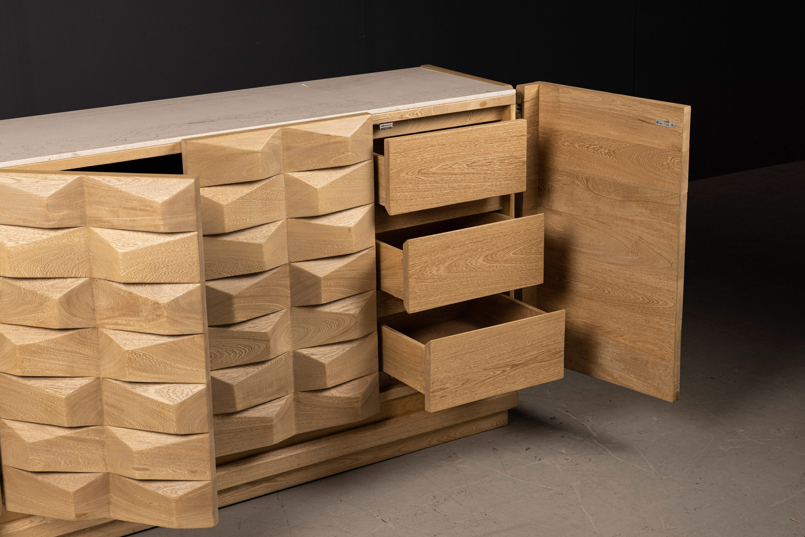 SENTIENT Escondido Credenza in Parota Wood With Open Doors SENTIENT Escondido Credenza in Parota Wood With Open Doors. High-quality image showcasing the design and details by SENTIENT Furniture.